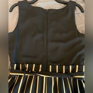 Black with yellow and white striped jumper